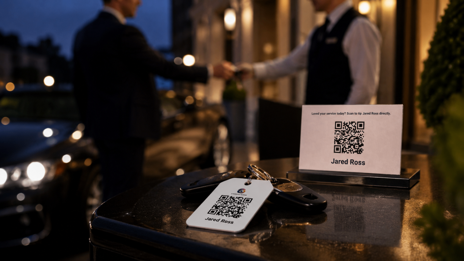 Valet station at night with an EZTipr QR sign and key tag on the counter.