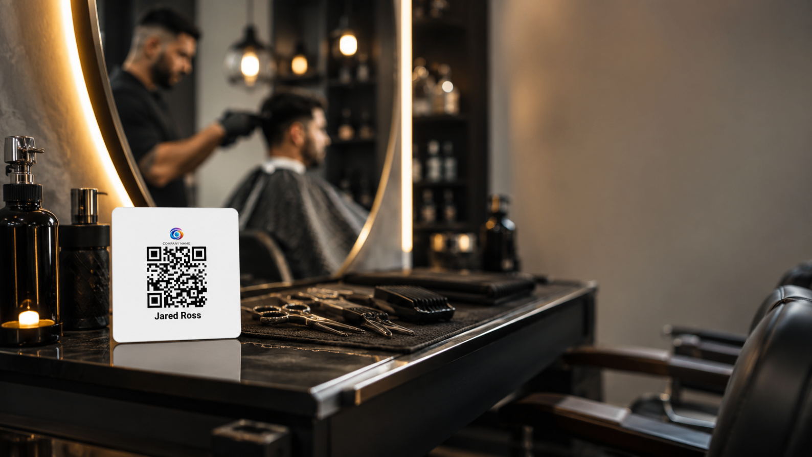 Barber station with an EZTipr QR display card on the counter.